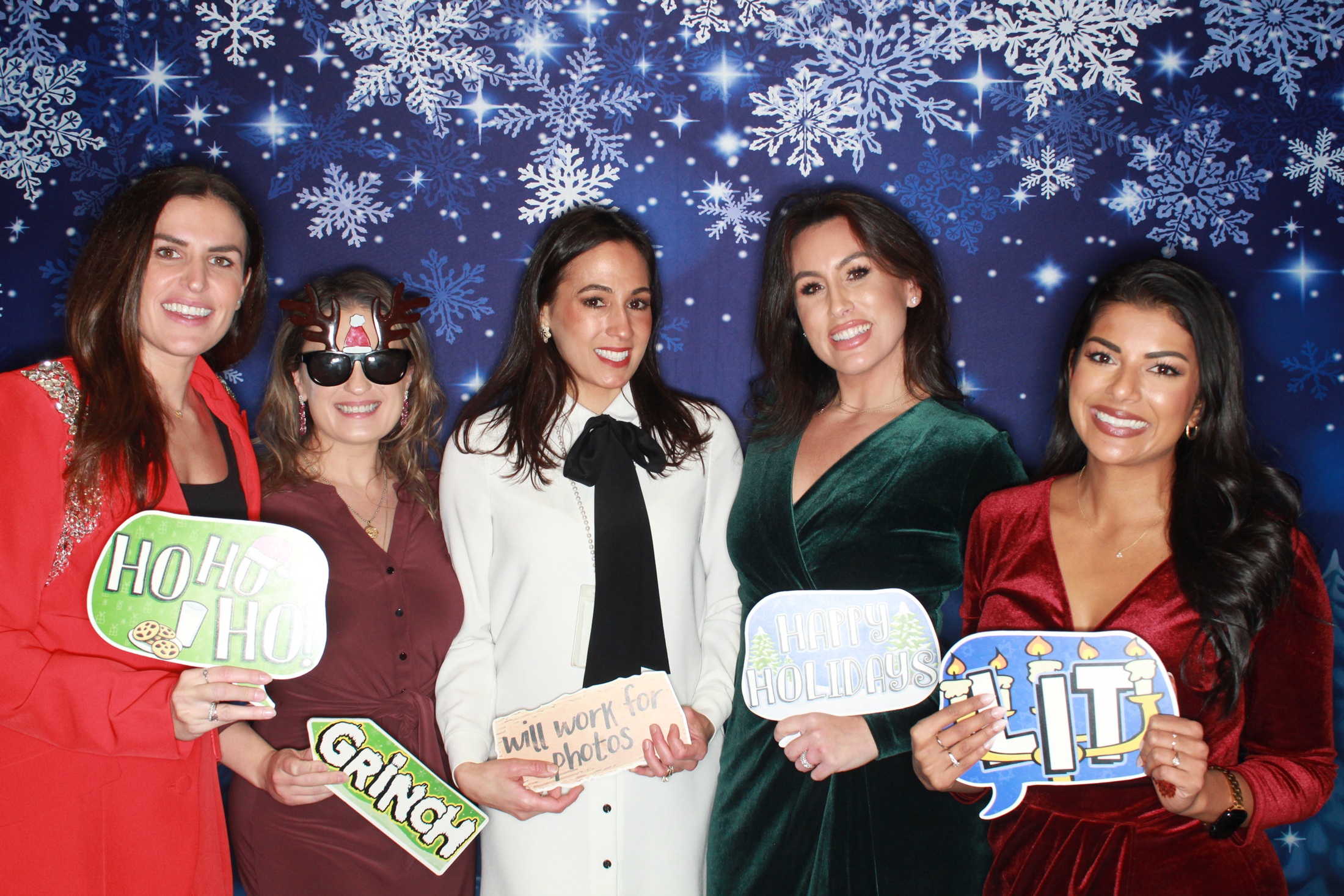 FOX5 coworkers posing at their company holiday party